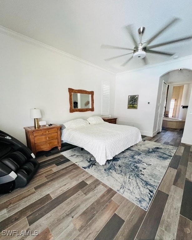 bedroom featuring hardwood / wood-style floors, ornamental molding, and ceiling fan