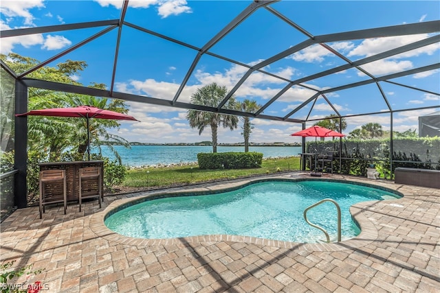 view of swimming pool with a patio, a water view, an outdoor bar, and glass enclosure