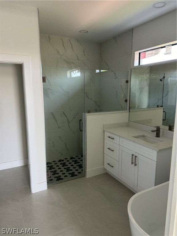 bathroom with vanity, an enclosed shower, and tile floors