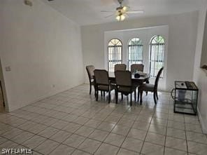 dining area featuring ceiling fan and light tile floors