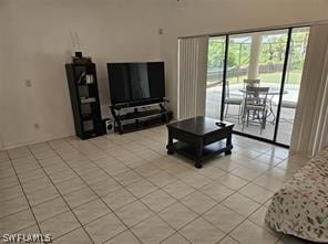 living room featuring light tile floors