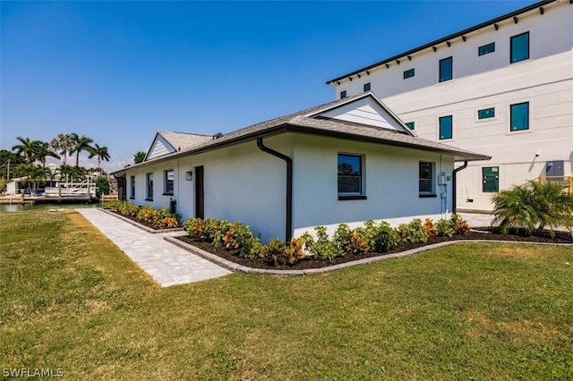 view of home's exterior featuring a yard