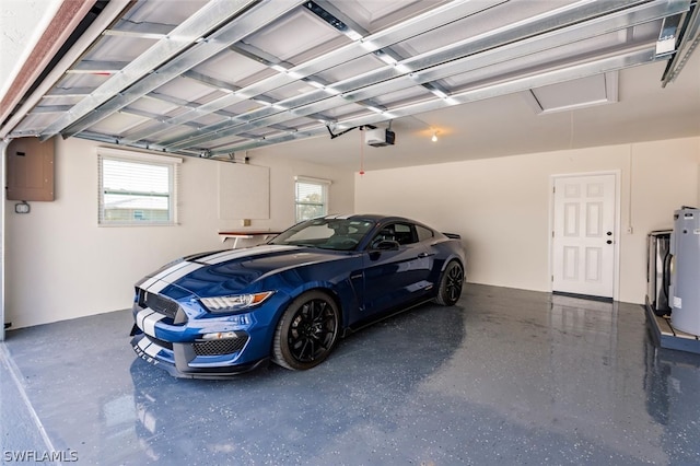 garage featuring electric water heater and a garage door opener