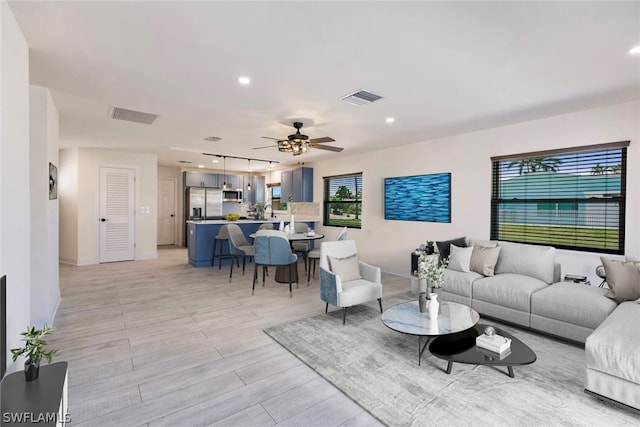 living room with ceiling fan