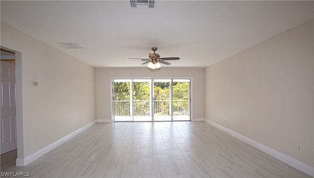 unfurnished room with ceiling fan