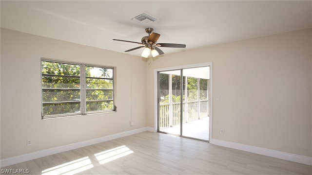 spare room with ceiling fan