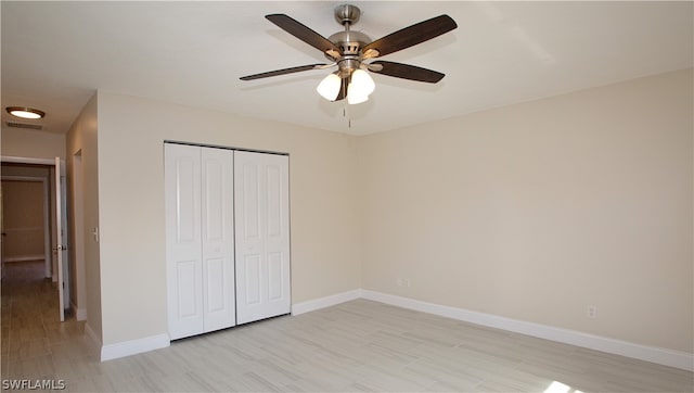 unfurnished bedroom with a closet and ceiling fan