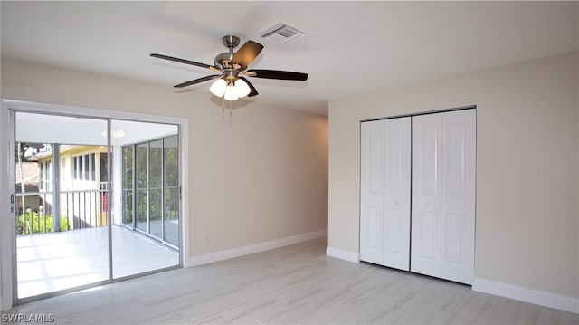 unfurnished bedroom with a closet, ceiling fan, and access to outside