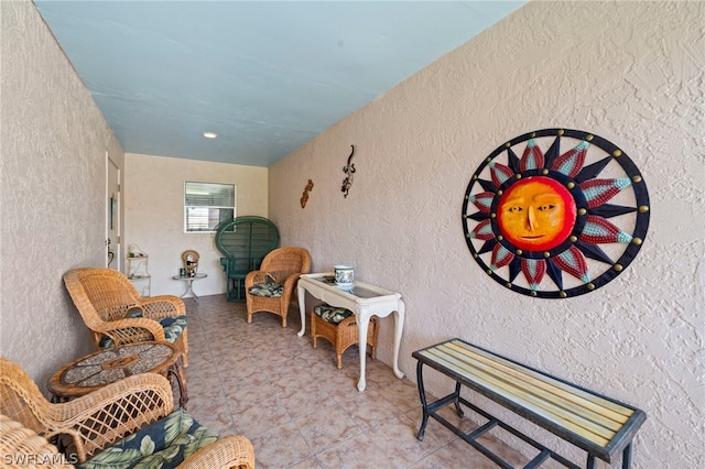 sitting room featuring tile floors