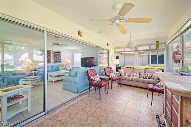 sunroom featuring ceiling fan