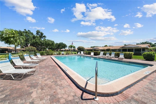 view of swimming pool featuring a patio area