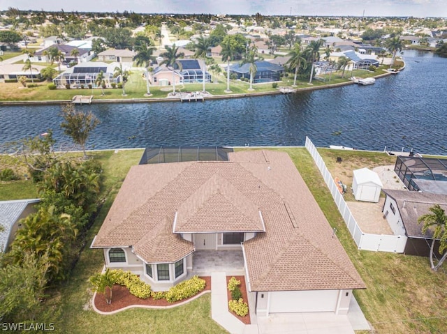 birds eye view of property featuring a water view