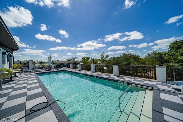 view of swimming pool with a patio area