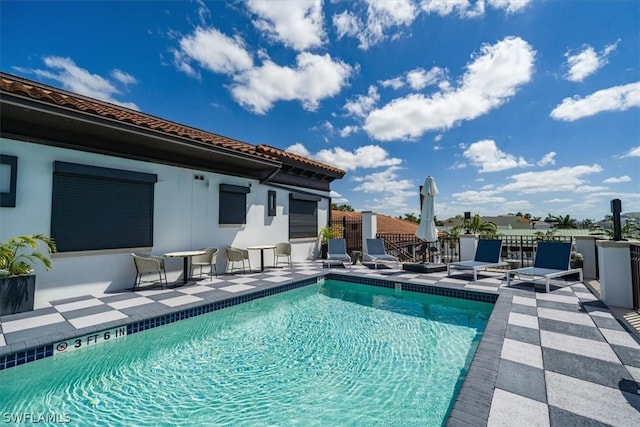 view of swimming pool with a patio area