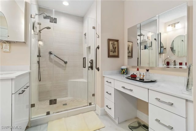 bathroom featuring vanity and an enclosed shower