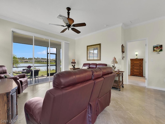 living room with light tile patterned flooring, ornamental molding, ceiling fan, and a water view