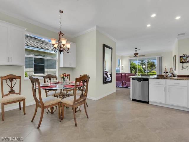 dining area featuring crown molding and ceiling fan with notable chandelier