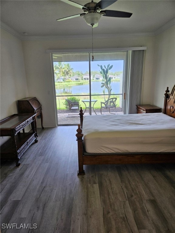 bedroom with crown molding, access to outside, dark hardwood / wood-style floors, and a water view