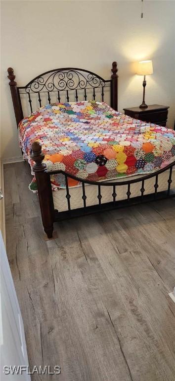 bedroom featuring hardwood / wood-style flooring