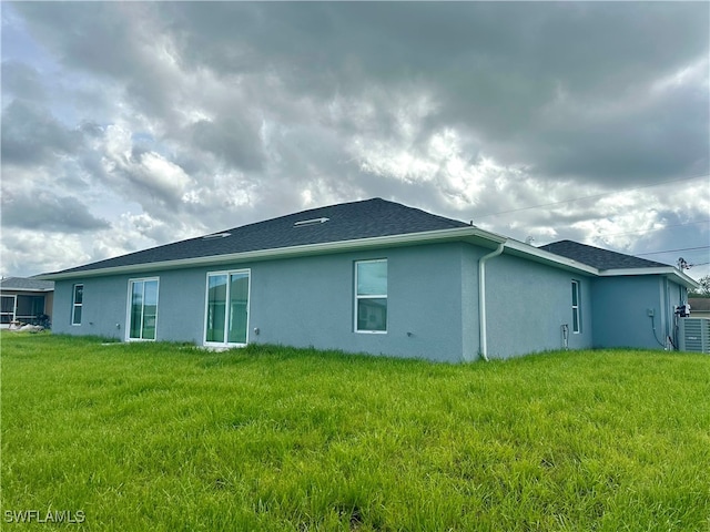 view of property exterior with a lawn and cooling unit