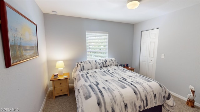 bedroom with light colored carpet and a closet