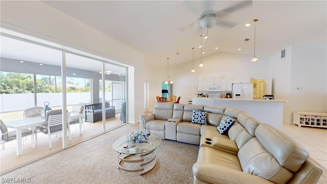 living room with light carpet, ceiling fan, and high vaulted ceiling