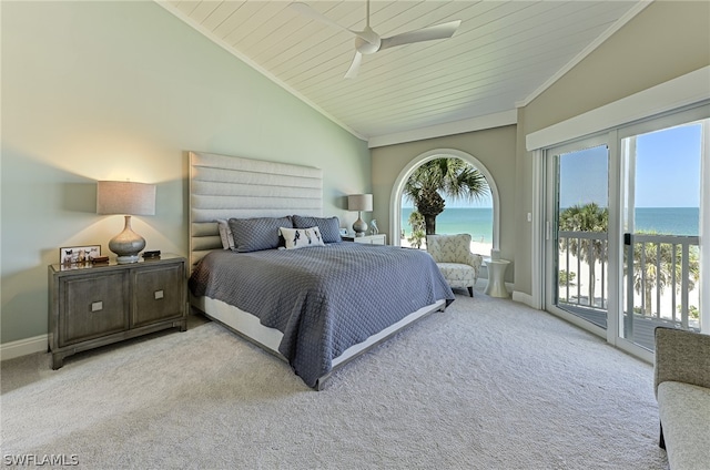 bedroom featuring light colored carpet, a water view, vaulted ceiling, and crown molding