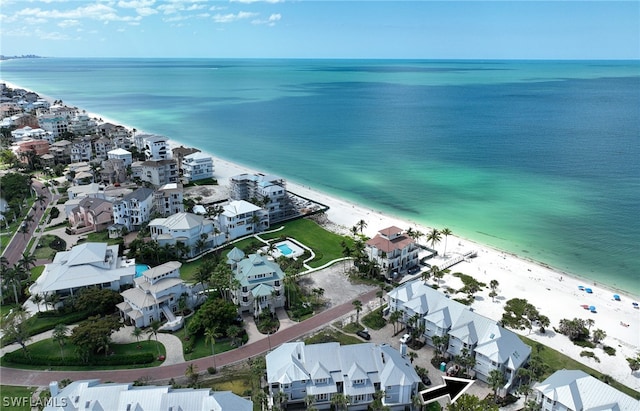 birds eye view of property featuring a water view and a view of the beach