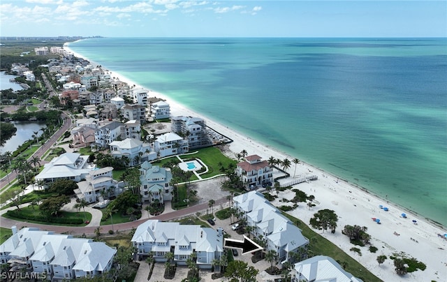 bird's eye view featuring a water view and a view of the beach