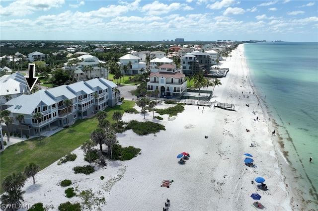 aerial view featuring a water view and a view of the beach