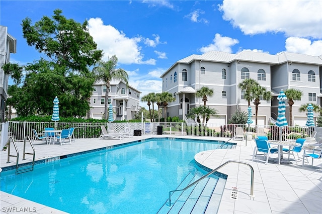 view of swimming pool with a patio