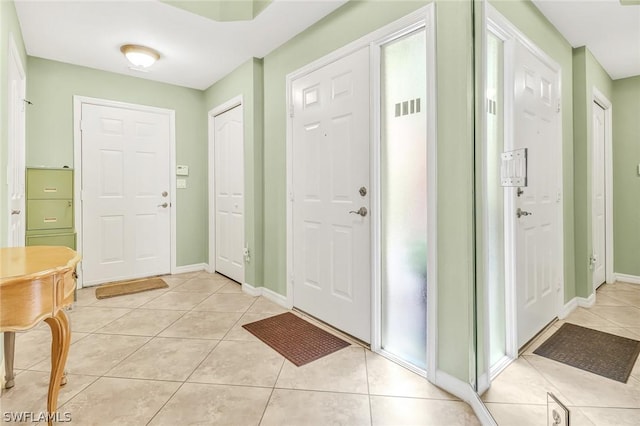 entrance foyer with light tile patterned flooring