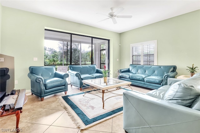 living room featuring light tile patterned floors and ceiling fan