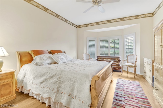 bedroom featuring light wood-type flooring and ceiling fan