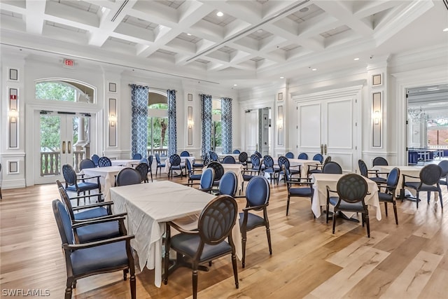 dining room with french doors, coffered ceiling, crown molding, beam ceiling, and light hardwood / wood-style flooring