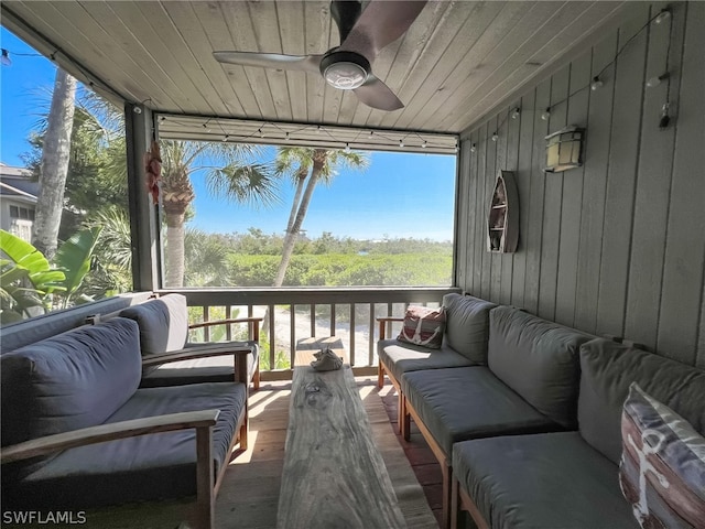 sunroom with wooden ceiling and ceiling fan