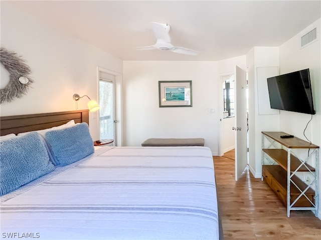 bedroom with wood-type flooring and ceiling fan