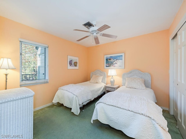 bedroom featuring carpet, ceiling fan, and a closet