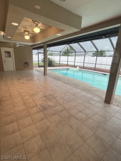 view of swimming pool featuring ceiling fan