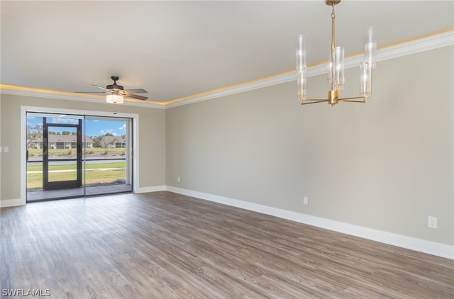 unfurnished room with ornamental molding, ceiling fan with notable chandelier, and hardwood / wood-style floors