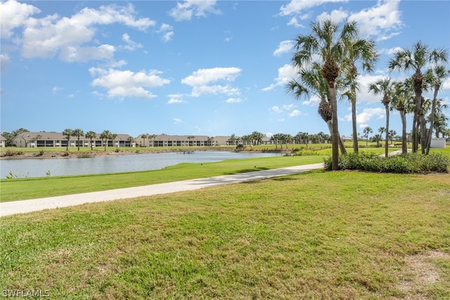 view of home's community featuring a yard and a water view