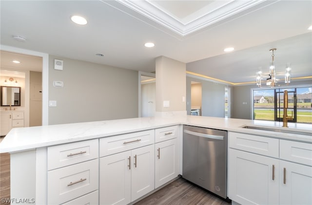 kitchen featuring white cabinets, hardwood / wood-style floors, kitchen peninsula, sink, and dishwasher