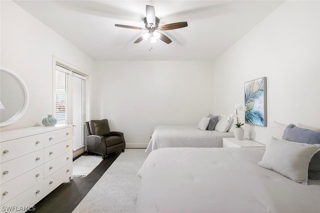 bedroom featuring ceiling fan and hardwood / wood-style flooring