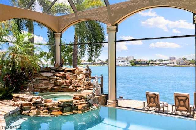 view of swimming pool with a water view