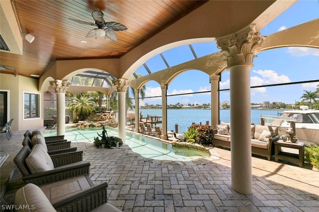 view of patio / terrace with a water view and ceiling fan