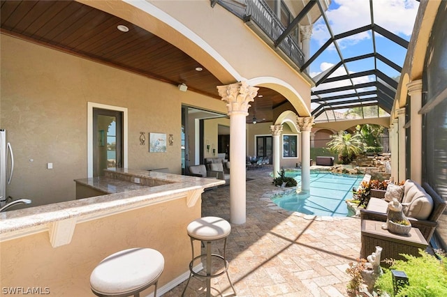 view of patio / terrace with glass enclosure