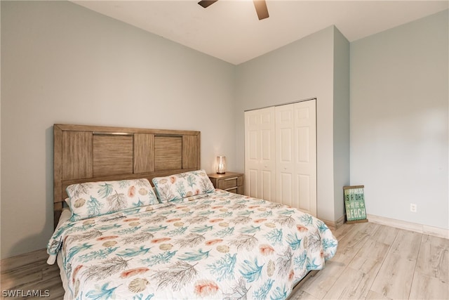 bedroom featuring a closet, ceiling fan, and light wood-type flooring