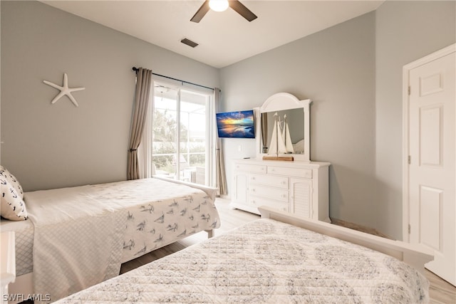 bedroom with ceiling fan and light wood-type flooring