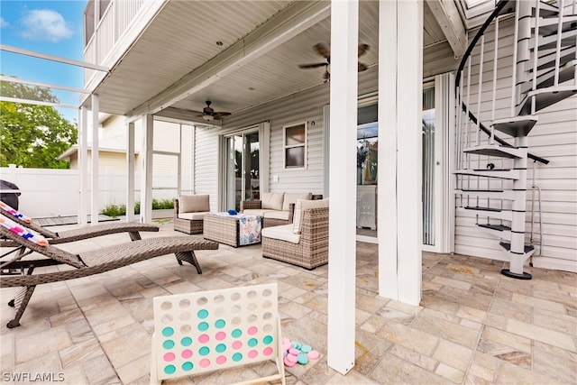 view of patio featuring ceiling fan