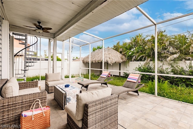 sunroom / solarium with ceiling fan